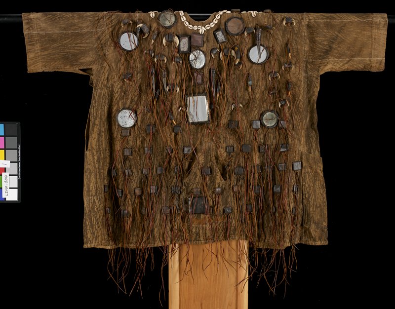 Another brown tunic, also with sleeves, and cowrie shells around the neckline. 