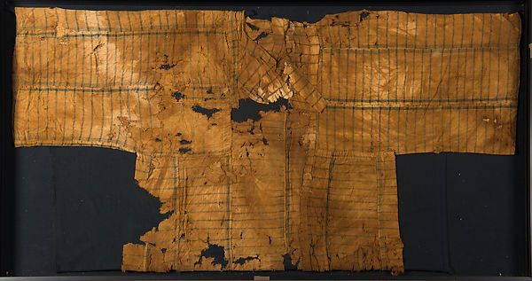 A brown tunic that seems to be falling apart, with thin black stripes on it.